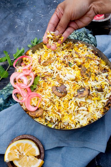 Taking a taste of mushroom biryani