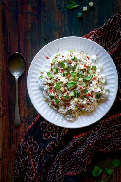 Cucumber Raita - a super easy and quick side dish with a punch of flavor from freshly toasted cumin seeds, herbs and chili.