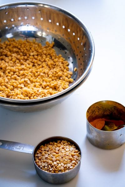 Tuver dal, Toor dal, or split-pigeon peas and turmeric for making Lachko Dal and Osaman