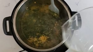 Add dal, turmeric and spinach
