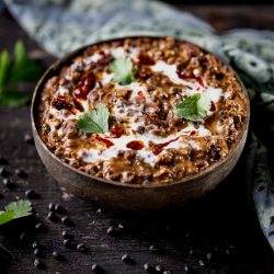 Bowl of dal makhani with cream on top