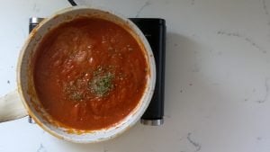 Add tomato paste and spices