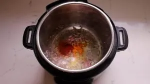 Add turmeric, kashmiri chili, garlic, ginger paste, tomato paste and salt