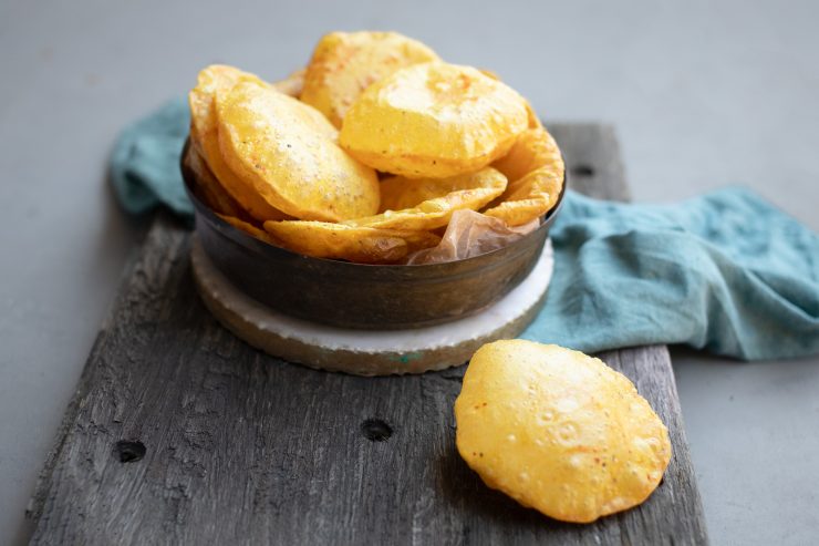 Masala puris, one is ballooned up in the front