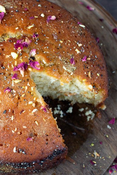 Gulab jamun cake with a slice removed