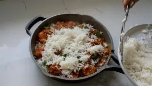 Layer the biryani in the cooking pan