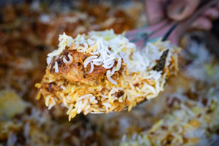 Serving chicken tikka biryani