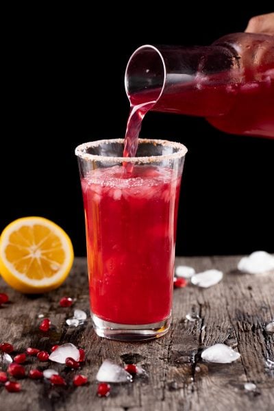 Pouring pomegranate lemonade