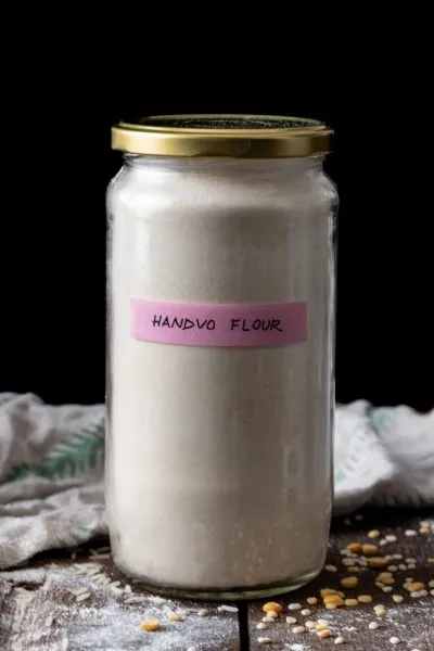 Handvo flour, stored in a jar.