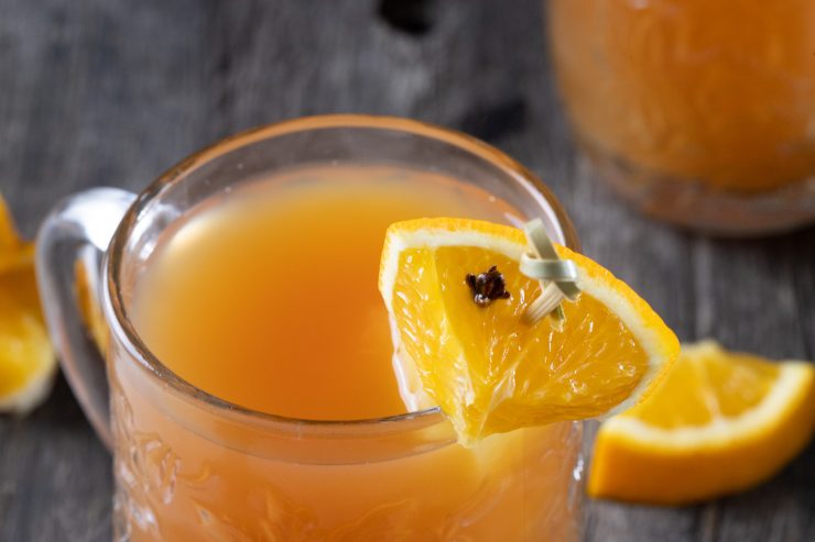 Garnish hot gin punch with orange and clove