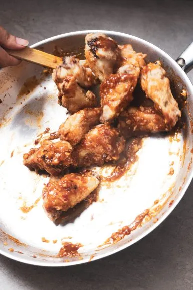 Toss the wings in the sauce.